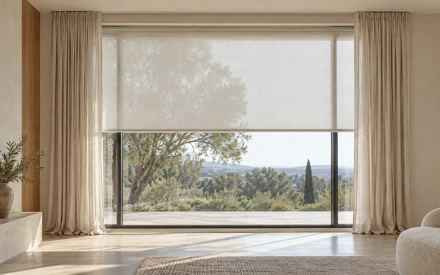 Architectural concept of a roller shade and linen drapery at a large window.